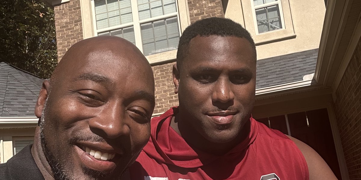 A MentorSports coach smiling with a college athlete